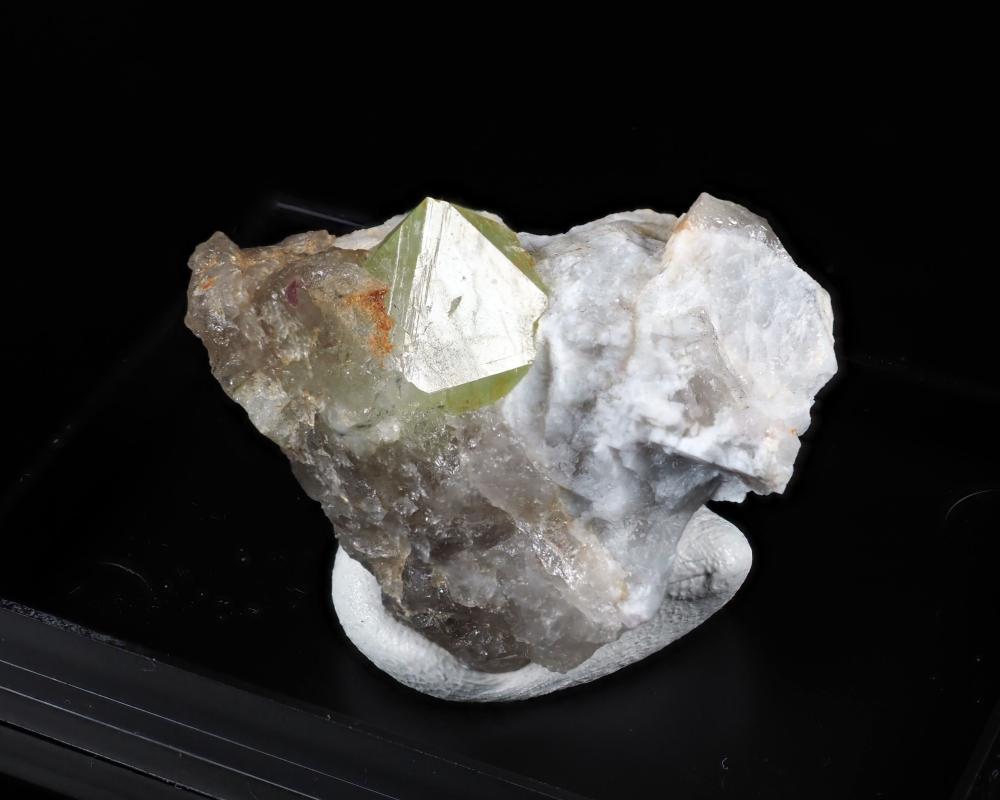Rhodizite X